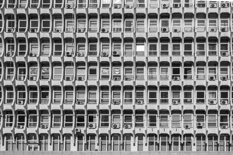 Soviet architecture. Facade of gray building with windows Stock Photos