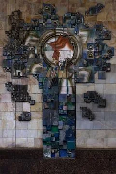 Soviet-era ceramic relief mural with red star in Tashkent Gafur Gulom metro.. Stock Photos
