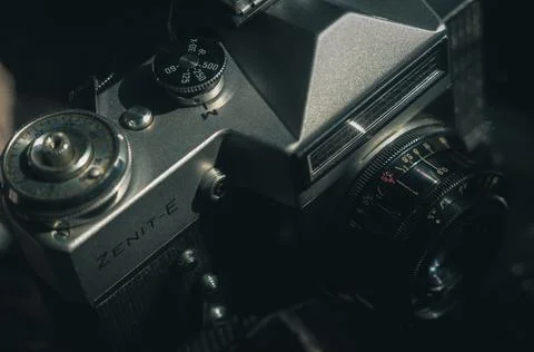 Soviet film camera Zenit-E with Industar 50-2 lens. Tilted composition, close-up Stock Photos