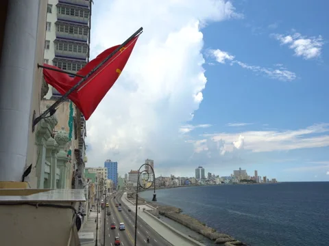 Soviet flag is fluttering on air in the high floor of building at Havana Stock Footage 71215117