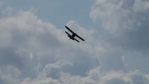 Soviet multipurpose biplane U-2 or Po-2 (NATO: Mule) - performs aerobatics. Stock Footage 116318524