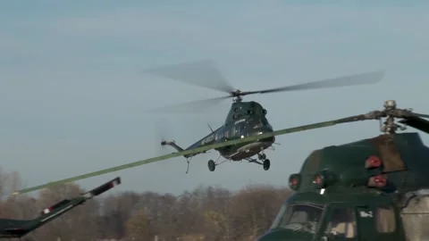 Soviet multipurpose helicopter Mi-2 (NATO: Hoplite) lands on runway. Stock Footage 139269697