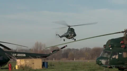 Soviet multipurpose helicopter Mi-2 (NATO: Hoplite) lands on runway. Stock Footage 139270171