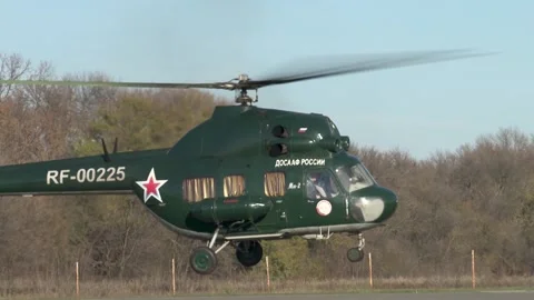Soviet multipurpose helicopter Mi-2 (NATO: Hoplite) lands on runway. Stock Footage 139270448