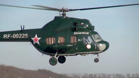 Soviet multipurpose helicopter Mi-2 (Hoplite) performs various aerobatics. Stock Footage 139273436