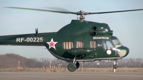 Soviet multipurpose helicopter Mi-2 (NATO: Hoplite) lands on runway. Stock Footage 139399704