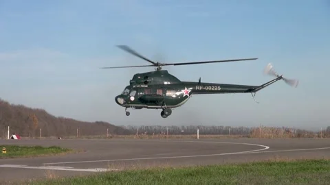 Soviet multipurpose helicopter Mi-2 (Hoplite) performs various aerobatics. Stock Footage 139407481