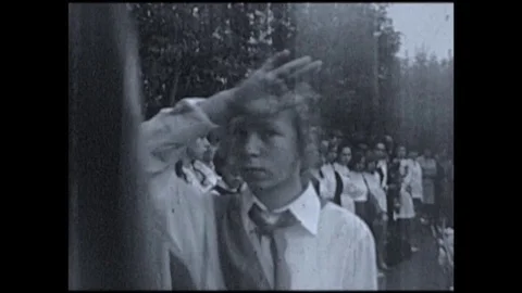 Soviet pioneers carrying flags Stock Footage 84187075