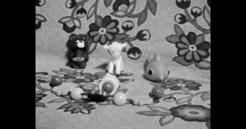 Soviet plastic toys including Olympic Misha Bear on floral background, USSR Stock Footage 328737461