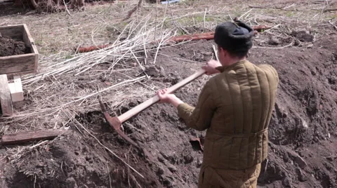 Soviet prisoner digging with a pick Stock Footage 51542123