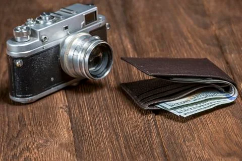 Soviet retro camera and wallet with money Stock Photos