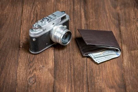 Soviet retro camera and wallet with money Stock Photos