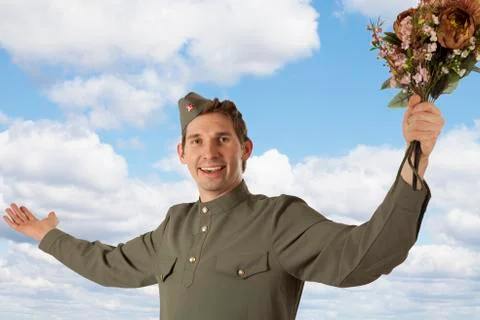 Soviet soldier with a bunch of flowers Фото