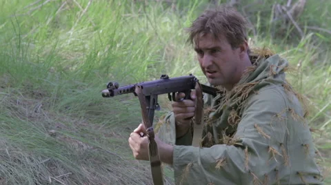 Soviet soldier fires back and drops the wounded. World war II. Stock Footage 63752998