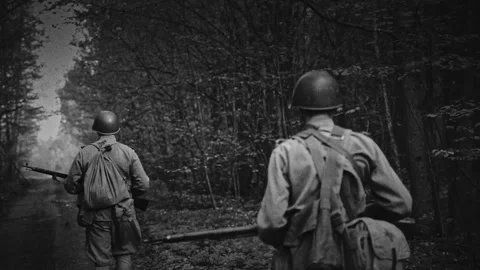 Soviet soldier walks in slow motion along a green spring forest path Stock Footage 341369800