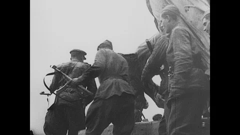 Soviet soldiers fly Soviet flag from the top of Chancelery in triumph Stock Footage 103382739