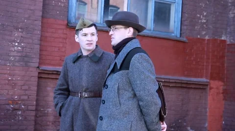 Soviet soldiers talking to a KGB agent Stock Footage 48077352