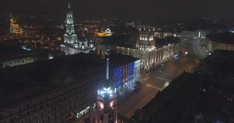 Soviet star at night on top of the building with cathedrals in back. Kharkiv UA Stock Footage 93848035