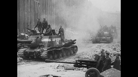 Soviet tanks and artillery fire as German civilians cut up horse for food Stock Footage 103383053