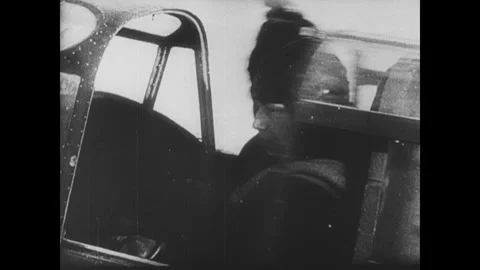 Soviet Union 1940s: Pilots head to airplanes on a snowy field. Paratroopers line Video stock 341981924