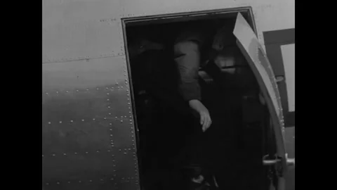 SOVIET UNION - 1944: Allied Handshake - Airman Stands In Open Aircraft Hatch Stock Footage 343997526