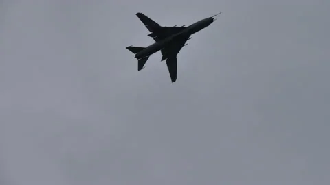 Soviet vintage variable sweep wing fighter bomber jet inflight from bottom Stock Footage 185583300