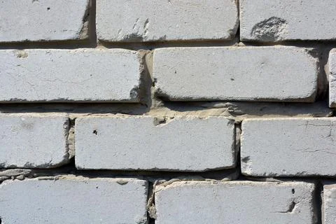 The Soviet wall is made of light, white brick. Stock Photos