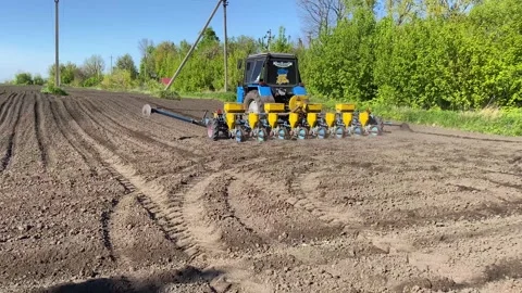 Sowing equipment in the field during spring works Stock Footage 240758647