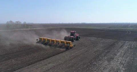 Sowing. A farmer on a big tractor sows a crop. Stock Footage 160545336