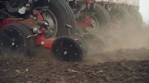 Sowing the field with corn grains. tractor works the field with a seeder. Stock Footage 206076945