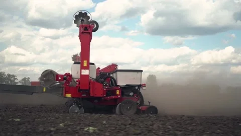 Sowing the field with corn grains. tractor works the field with a seeder. 動画素材 206077234
