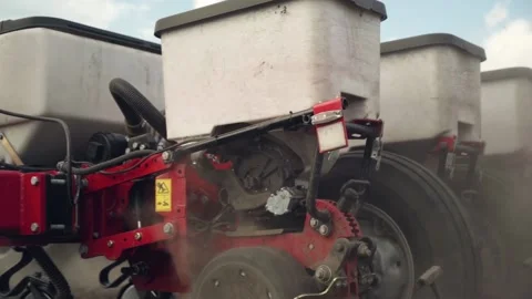 Sowing the field with corn grains. tractor works the field with a seeder. 動画素材 207786271