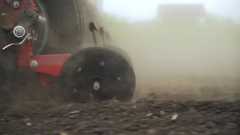 Sowing the field with corn grains. tractor works the field with a seeder. Stock Footage 210554973