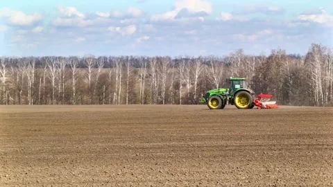 Sowing machinery in the field during spring work. Stock Footage 154165916