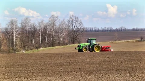 Sowing machinery in the field during spring work. Stock Footage 154165918