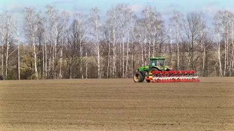 Sowing machinery in the field during spring work. Stock Footage 154165919