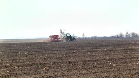 Sowing machinery in the field during spring work. Stock Footage 154165922