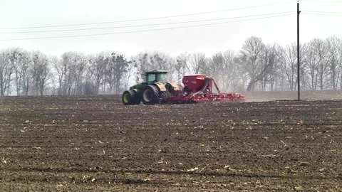 Sowing machinery in the field during spring work. Stock Footage 154165932