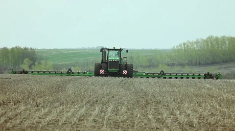 Sowing of sweet corn by using contemporary agricultural machinery Stock-Footage 61605771