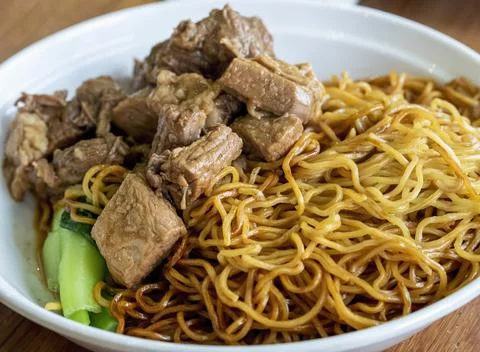 Soy sauce based pieces of beef stewed briskets on Asian egg noodles Stock Photos