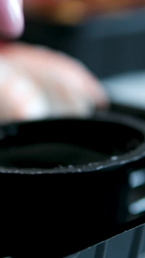Soy sauce in plastic container near black sushi takeaway boxes delivery food Stock Footage 346183819