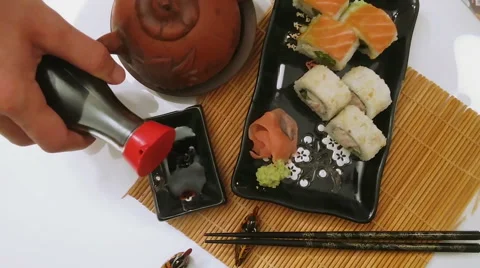 Soy sauce is poured from a bottle. Stock Footage 69027895
