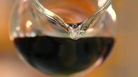 Soy sauce is poured from a carafe slow motion Stock Footage