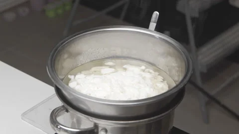 Soy wax is melted to make handmade candles Stock Footage 183360146