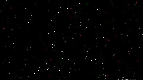 Soybean seeds falling in slow motion against a dark background with subtle .. Video stock 345320843