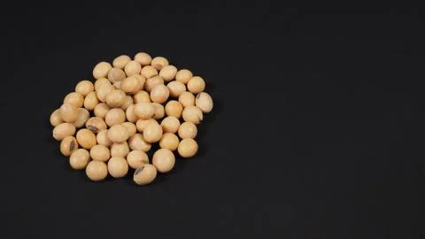 Soybeans close up on black background Stock Photos