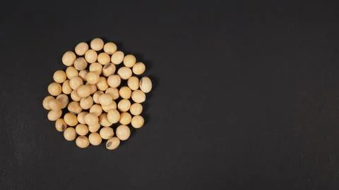 Soybeans close up on black background Stock Photos