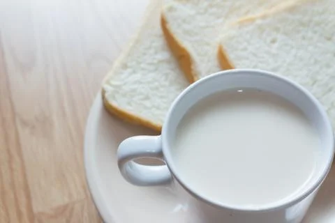 Soymilk and bread Stock Photos
