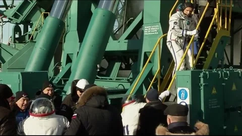 Soyuz MS-11 Astronauts Ononenko, McClain, Saint-Jacques arrive at launchpad Stock Footage 273697548