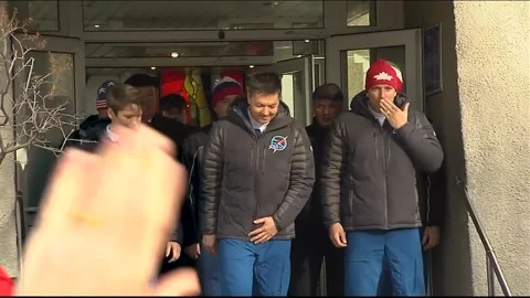 Soyuz MS-11 Astronauts Ononenko, McClain, Saint-Jacques exiting crew quarters Stock Footage 273697678